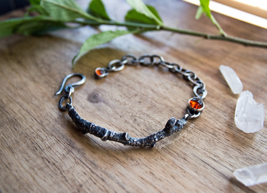 Silver twig bracelet with amber