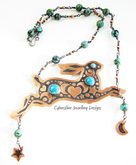 Copper, silver and turquoise hare decorated with triple moons, stars and hearts
