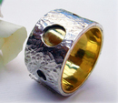 Textured silver and brass ring