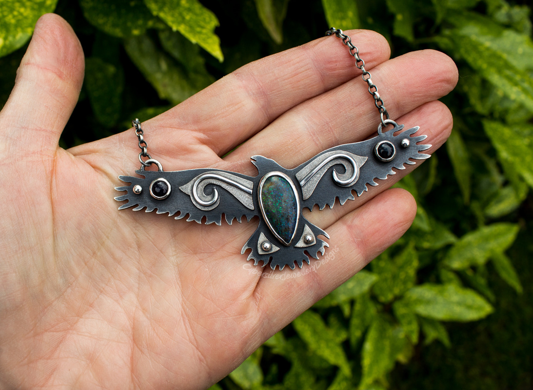Silver raven with opals