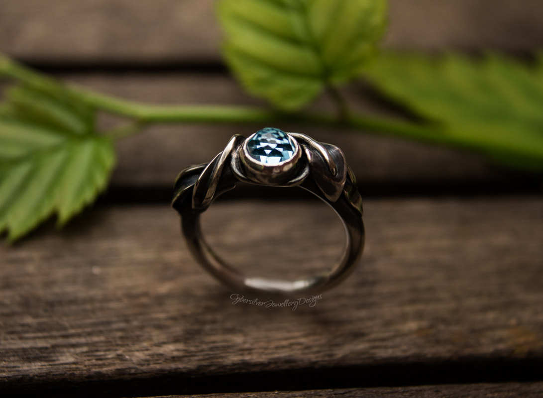 Blue topaz leaf ring