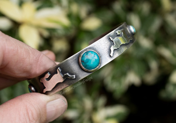 Silver leaping hare cuff with turquoise